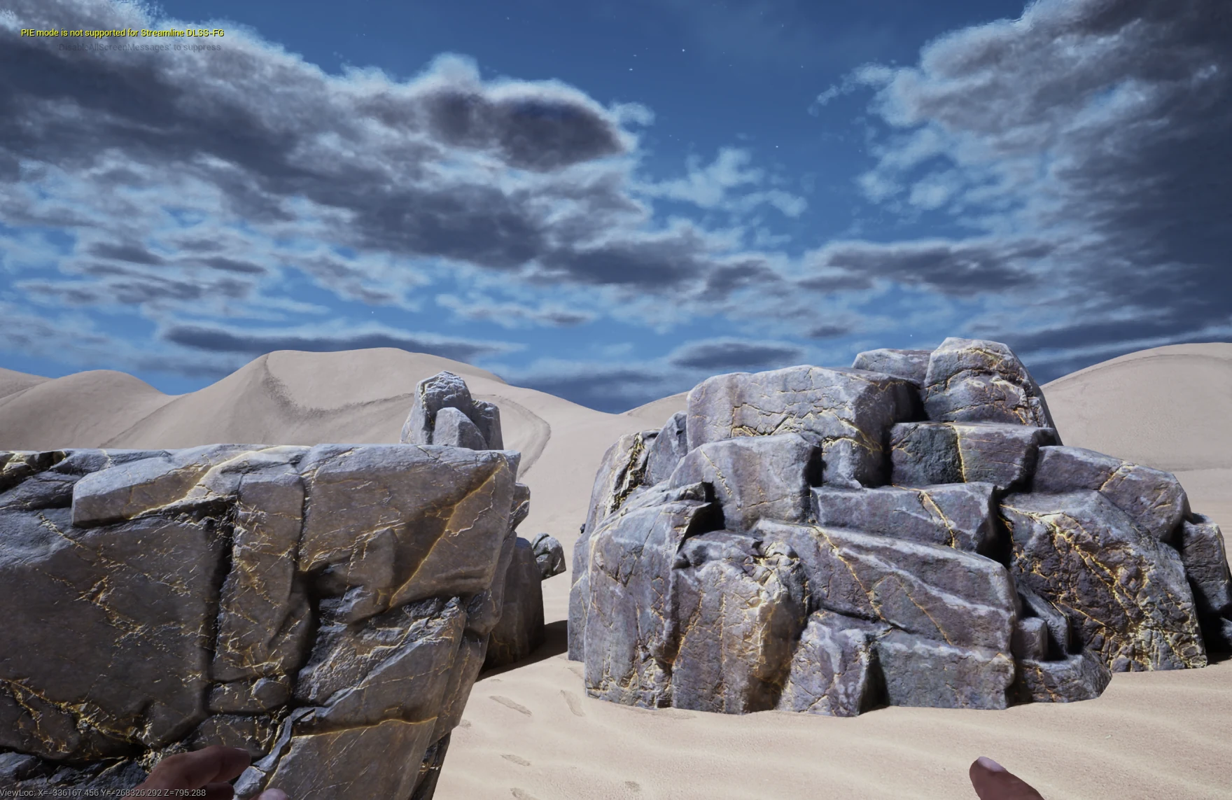 First-person in-game view of pale fractured rocks on a sandy Palmreach test area